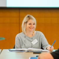 Kathleen Scheuerle talking with another guest.